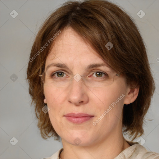 Joyful white adult female with medium  brown hair and blue eyes