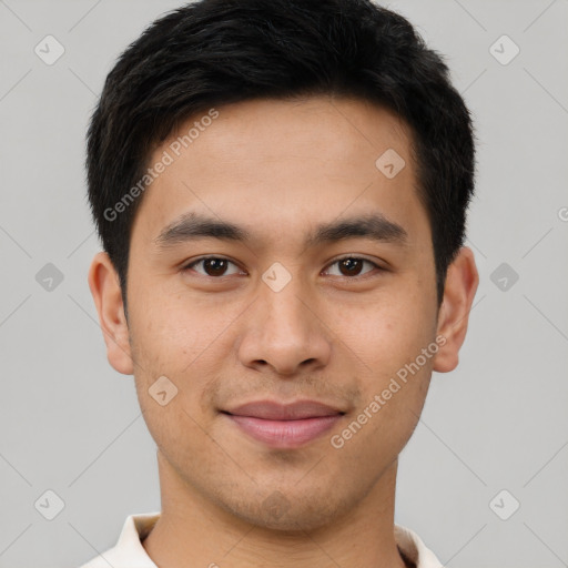 Joyful asian young-adult male with short  brown hair and brown eyes