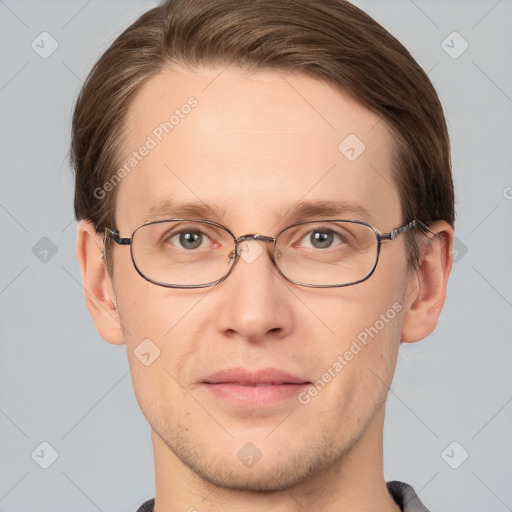 Joyful white adult male with short  brown hair and grey eyes