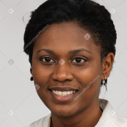 Joyful black young-adult female with short  black hair and brown eyes