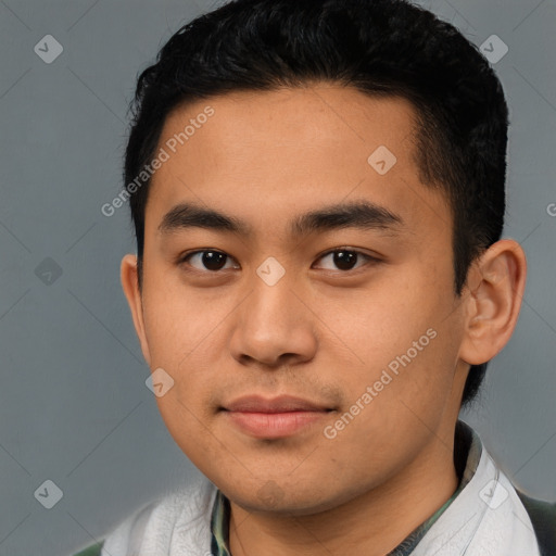 Joyful asian young-adult male with short  brown hair and brown eyes