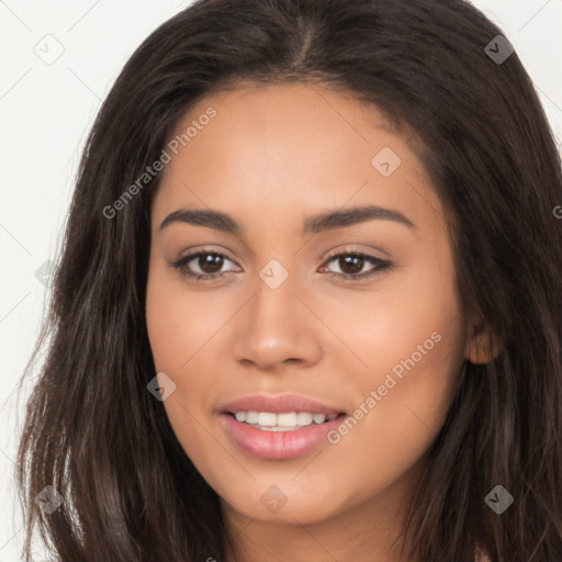 Joyful latino young-adult female with long  brown hair and brown eyes