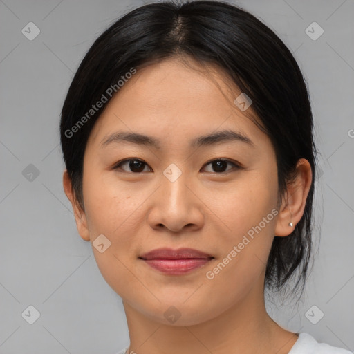 Joyful asian young-adult female with medium  brown hair and brown eyes