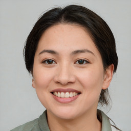 Joyful white young-adult female with medium  brown hair and brown eyes