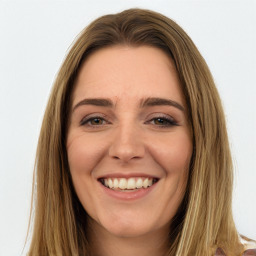 Joyful white young-adult female with long  brown hair and green eyes