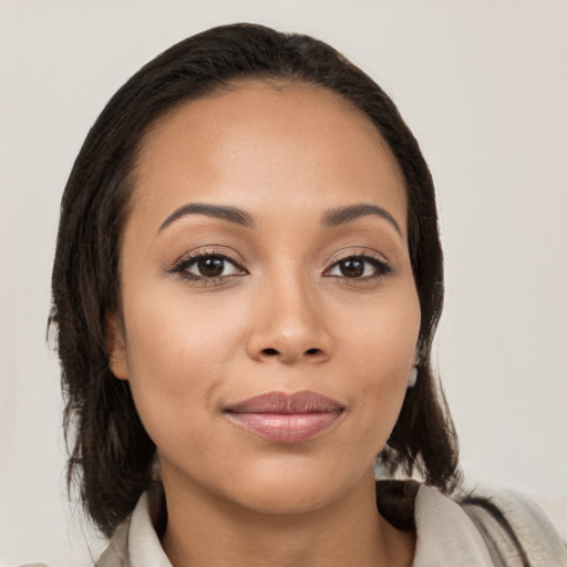 Joyful white young-adult female with medium  brown hair and brown eyes