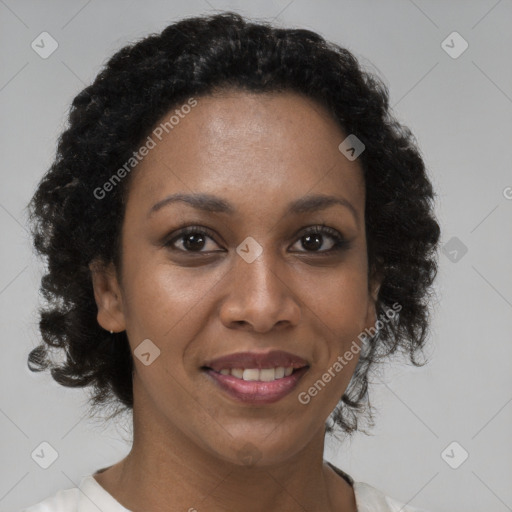 Joyful black adult female with short  brown hair and brown eyes