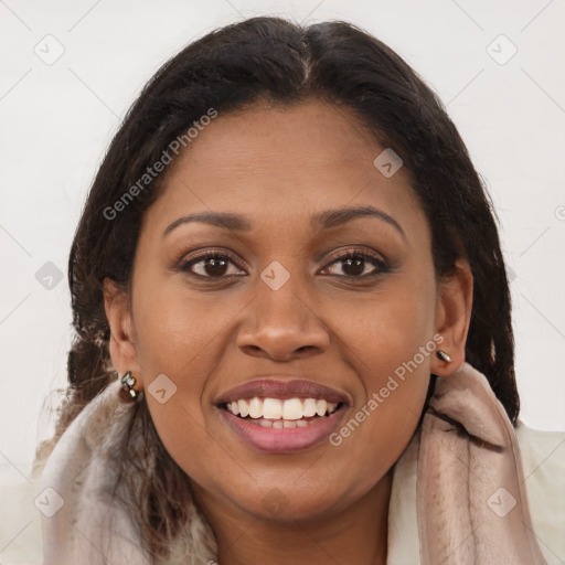Joyful black young-adult female with long  brown hair and brown eyes