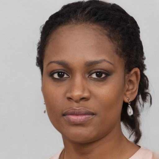 Neutral black young-adult female with long  black hair and brown eyes