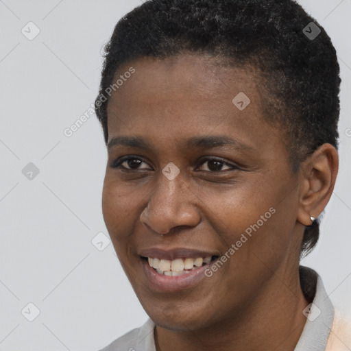 Joyful black young-adult female with short  brown hair and brown eyes