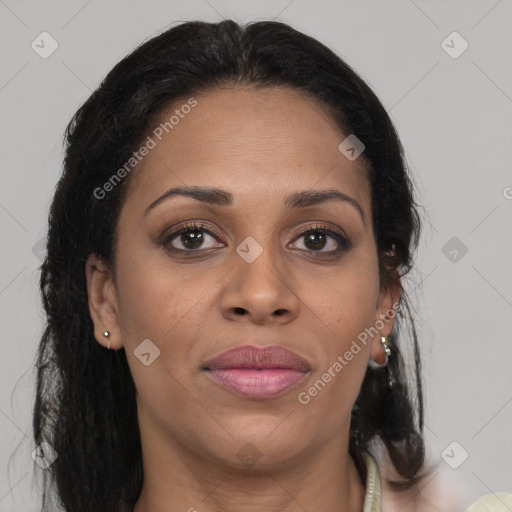 Joyful black young-adult female with long  brown hair and brown eyes