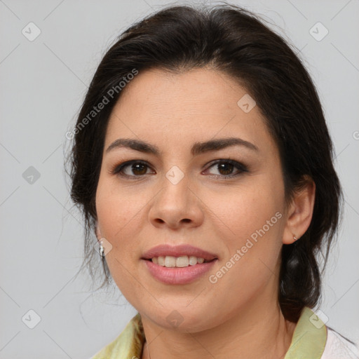 Joyful latino young-adult female with medium  brown hair and brown eyes