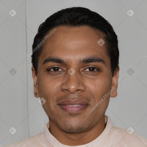 Joyful black young-adult male with short  black hair and brown eyes
