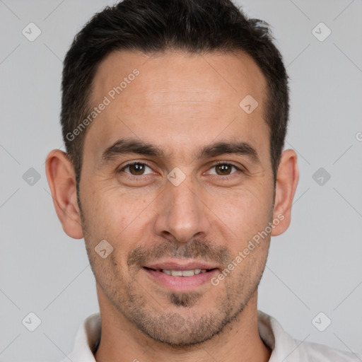 Joyful white adult male with short  brown hair and brown eyes