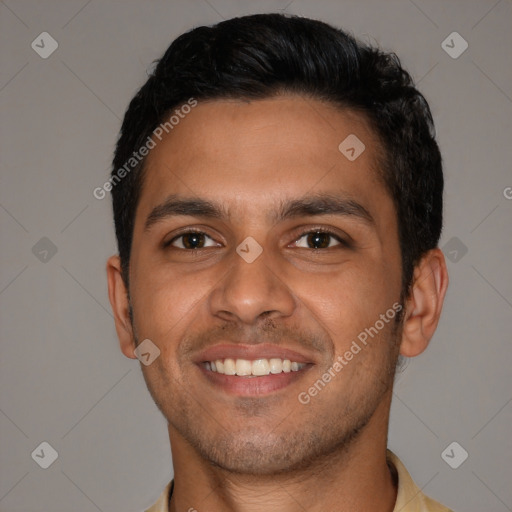 Joyful latino young-adult male with short  black hair and brown eyes