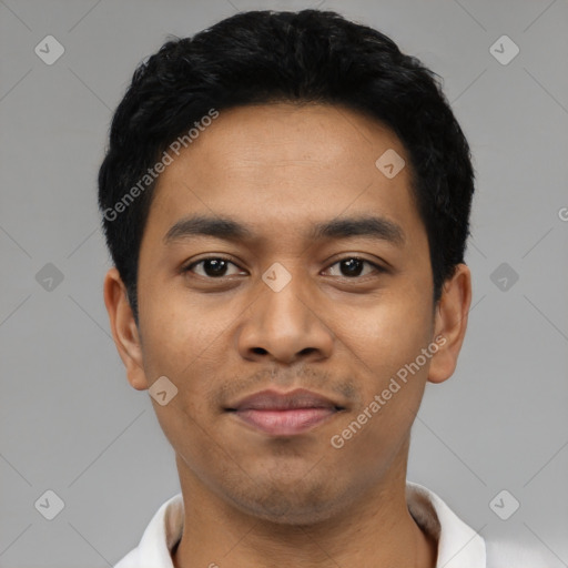 Joyful latino young-adult male with short  black hair and brown eyes