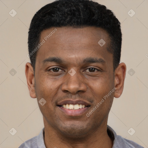 Joyful black young-adult male with short  black hair and brown eyes