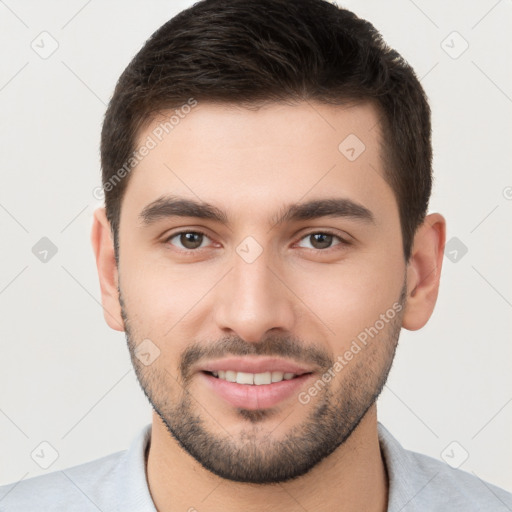 Joyful white young-adult male with short  brown hair and brown eyes