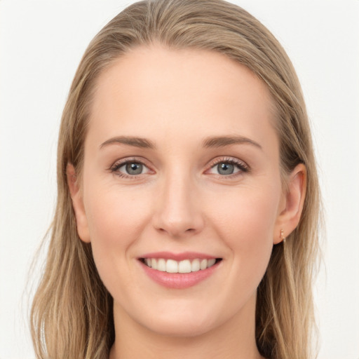 Joyful white young-adult female with long  brown hair and grey eyes