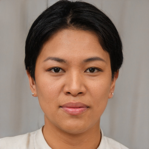 Joyful asian young-adult female with short  brown hair and brown eyes
