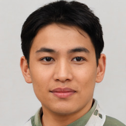 Joyful asian young-adult male with short  brown hair and brown eyes