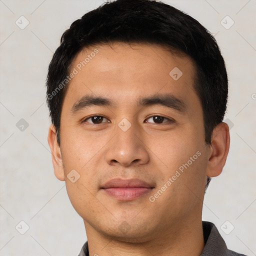 Joyful latino young-adult male with short  black hair and brown eyes