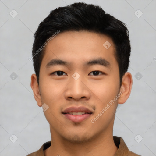 Joyful asian young-adult male with short  black hair and brown eyes