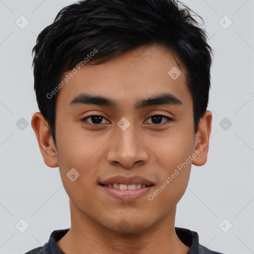 Joyful asian young-adult male with short  black hair and brown eyes