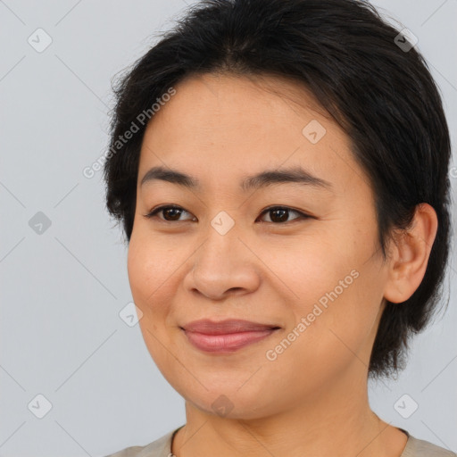 Joyful asian young-adult female with medium  brown hair and brown eyes