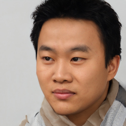 Neutral asian young-adult male with short  black hair and brown eyes
