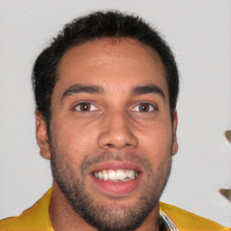 Joyful white young-adult male with short  black hair and brown eyes