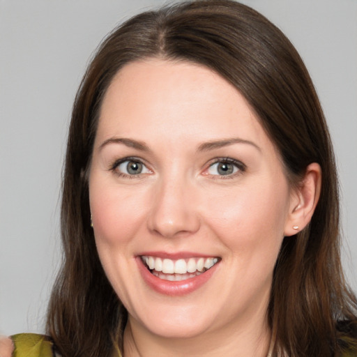 Joyful white young-adult female with medium  brown hair and brown eyes