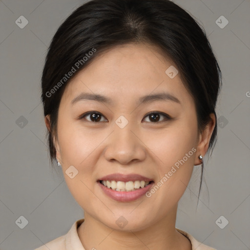 Joyful asian young-adult female with medium  brown hair and brown eyes