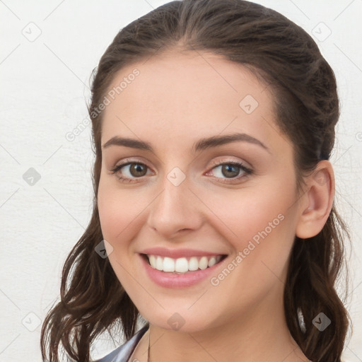 Joyful white young-adult female with long  brown hair and blue eyes