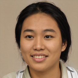 Joyful asian young-adult female with medium  black hair and brown eyes