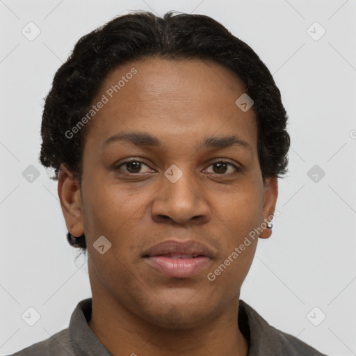 Joyful black adult female with short  brown hair and brown eyes