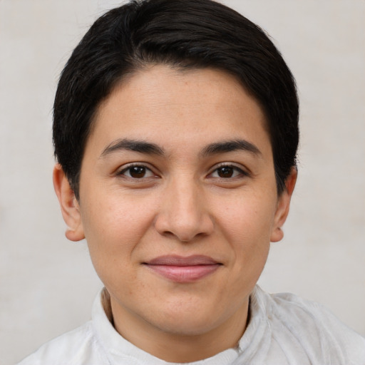 Joyful latino young-adult female with short  brown hair and brown eyes