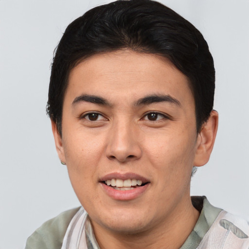 Joyful asian young-adult male with short  brown hair and brown eyes