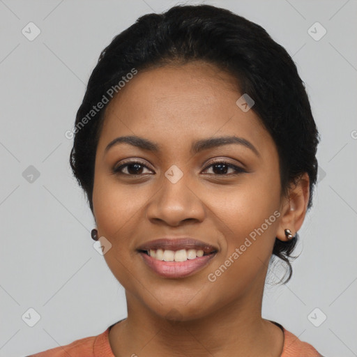 Joyful latino young-adult female with short  black hair and brown eyes