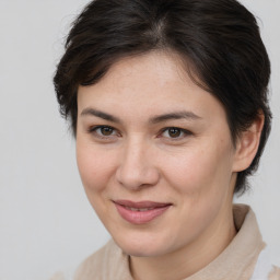 Joyful white young-adult female with medium  brown hair and brown eyes