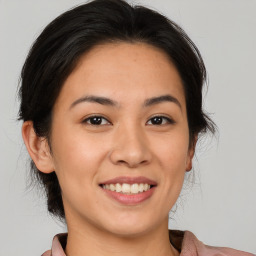 Joyful white young-adult female with medium  brown hair and brown eyes