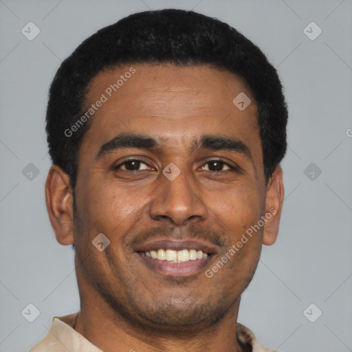 Joyful black young-adult male with short  black hair and brown eyes