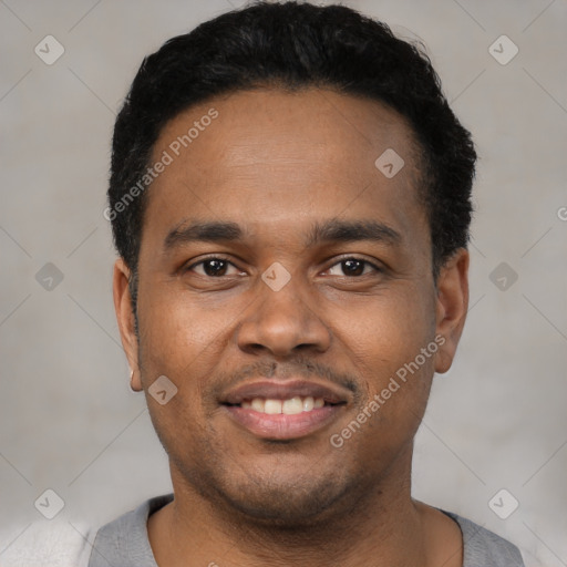 Joyful black young-adult male with short  black hair and brown eyes