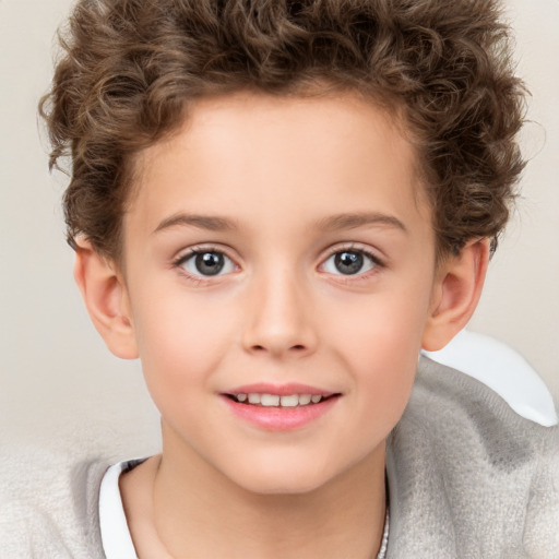 Joyful white child female with short  brown hair and brown eyes