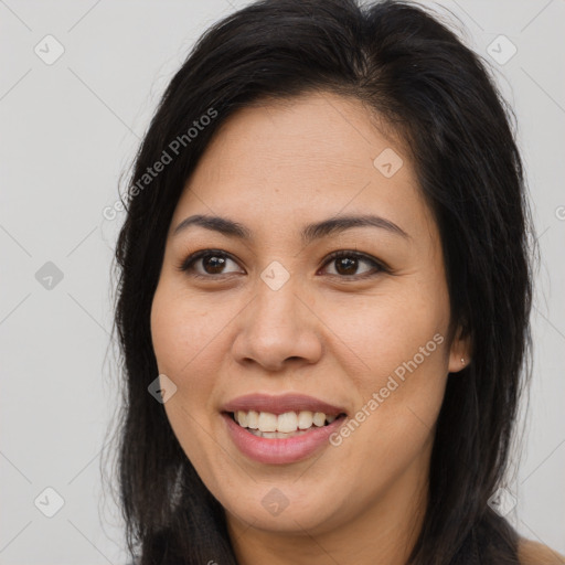 Joyful asian young-adult female with long  brown hair and brown eyes