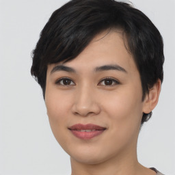 Joyful asian young-adult female with short  black hair and brown eyes