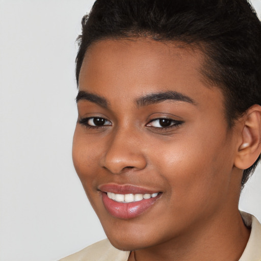 Joyful latino young-adult female with short  brown hair and brown eyes