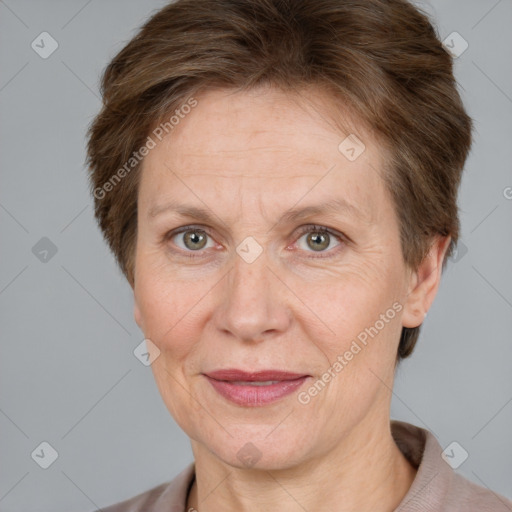 Joyful white adult female with short  brown hair and grey eyes