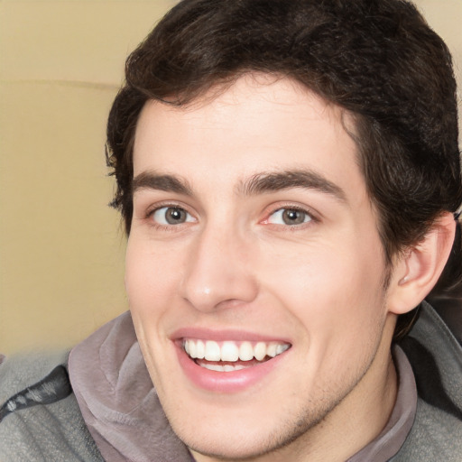 Joyful white young-adult male with medium  brown hair and brown eyes