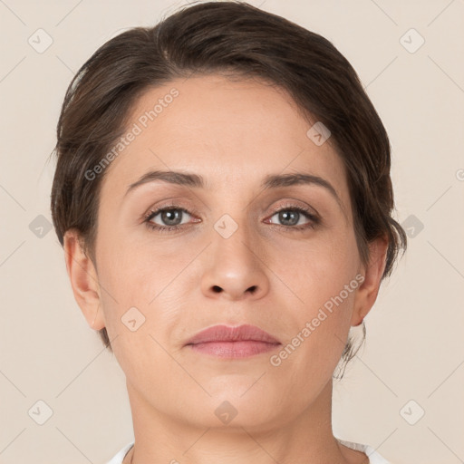 Joyful white adult female with short  brown hair and brown eyes